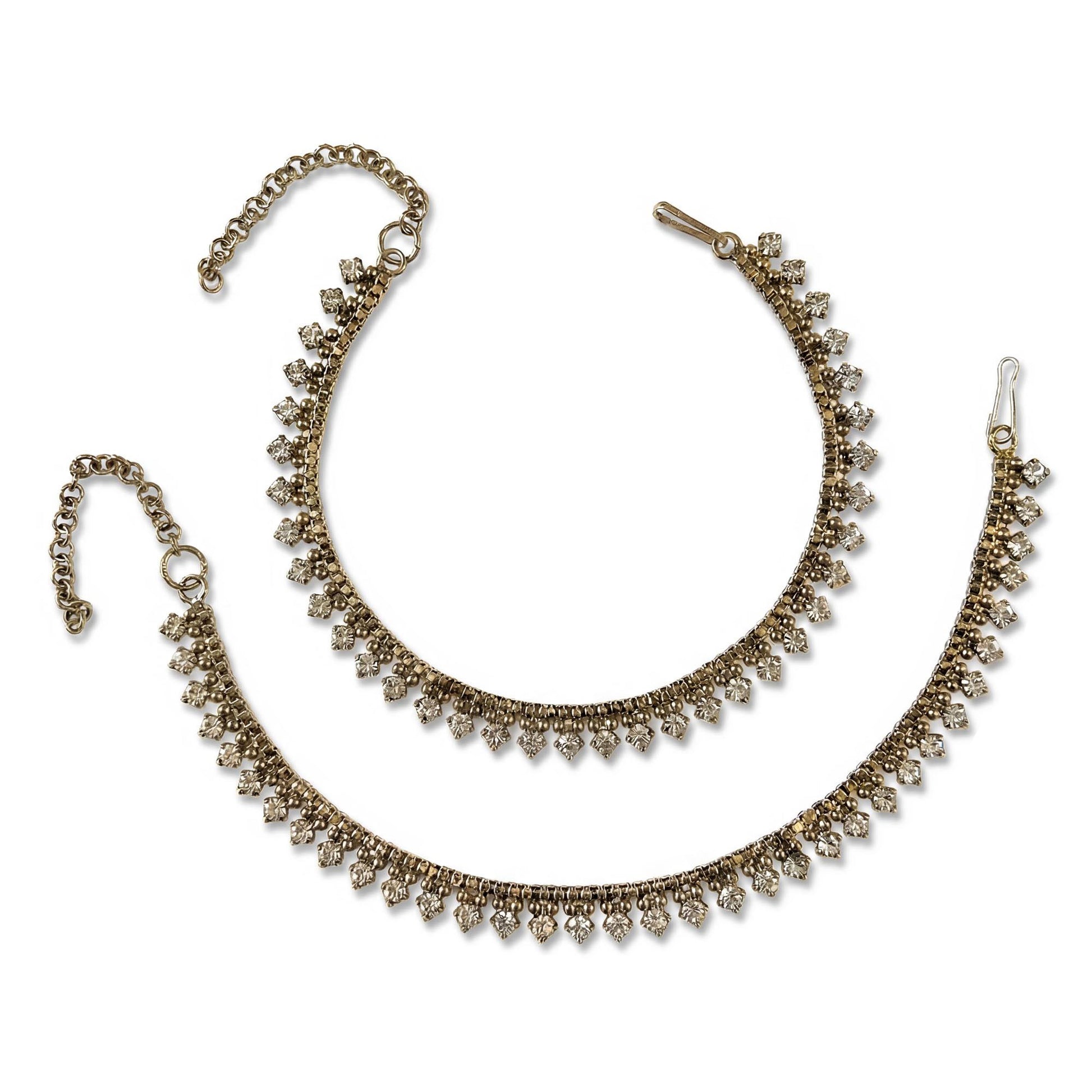 Antique golden anklet payal on a white background. Traditional Indian and Pakistani jewellery