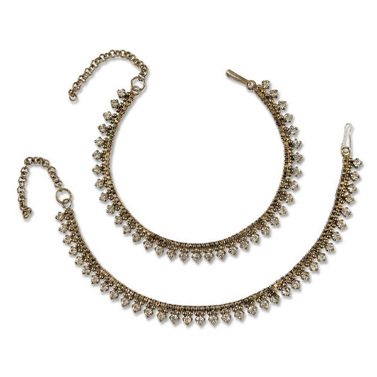 Antique golden anklet payal on a white background. Traditional Indian and Pakistani jewellery