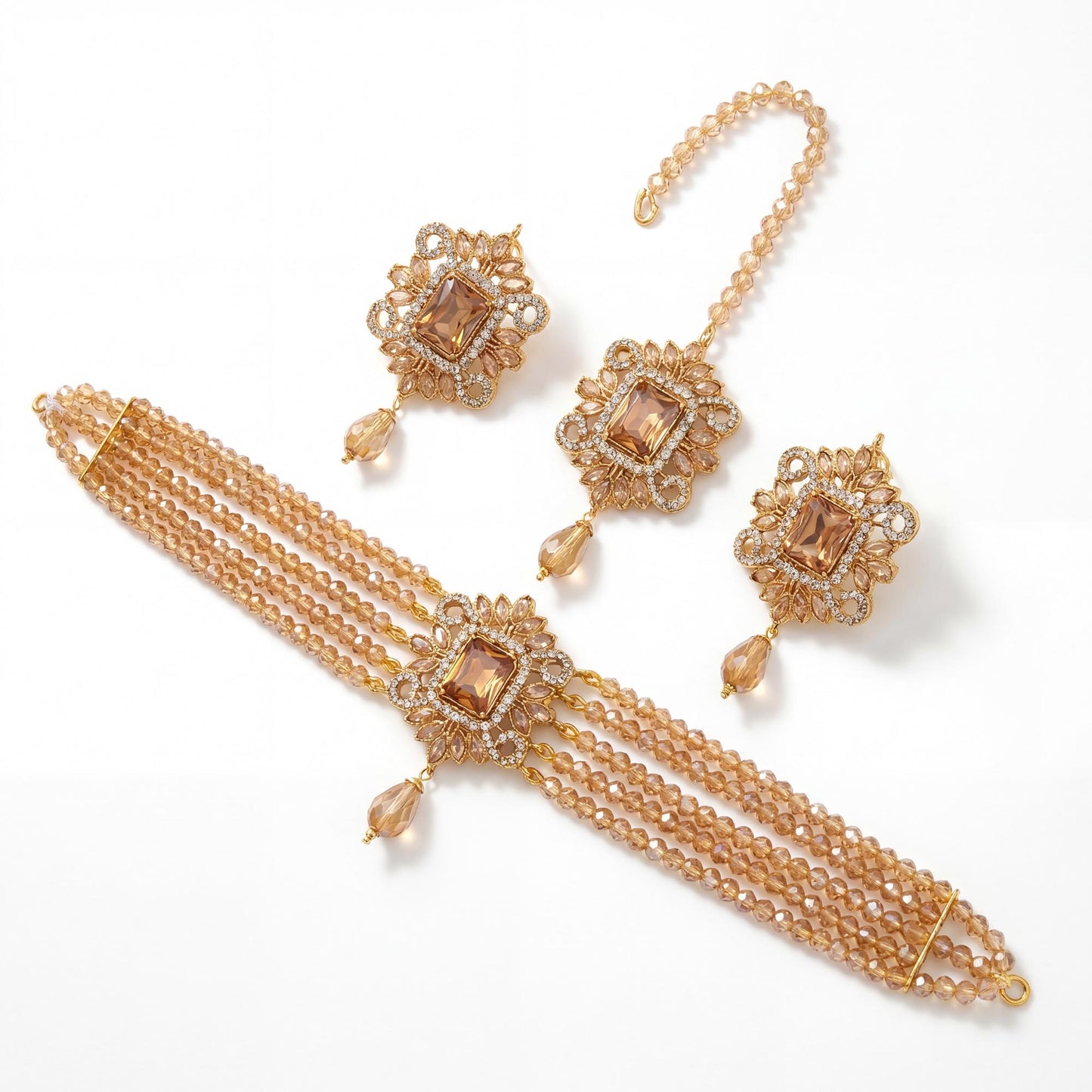 champagne choker set with necklace, earrings, and maaang tikka on a white background