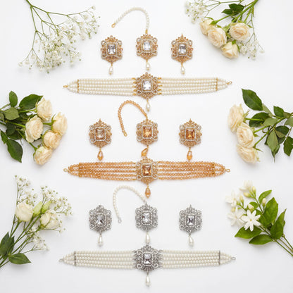 collection of 3 choker sets in pearls, golden and silver white on a white background