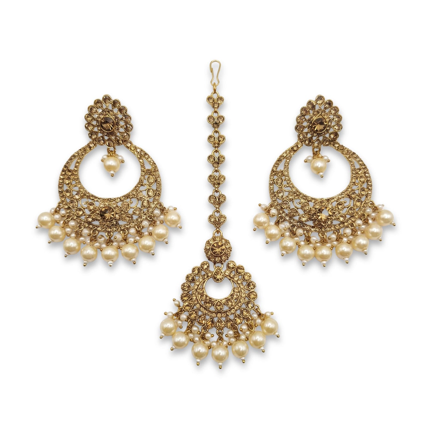 golden earrings and a mang tikka set