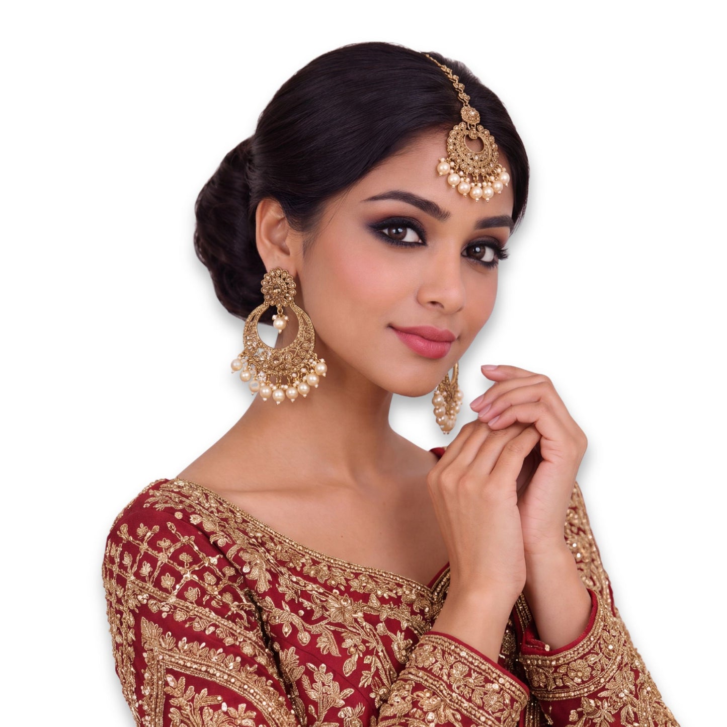 golden earrings and a mang tikka set