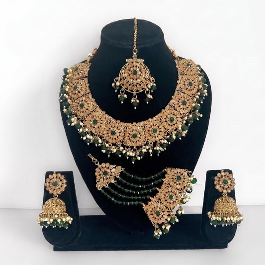 Handcrafted green necklace set with earrings, tikka, and jhoomar, perfect for Indian party wear and festive occasions