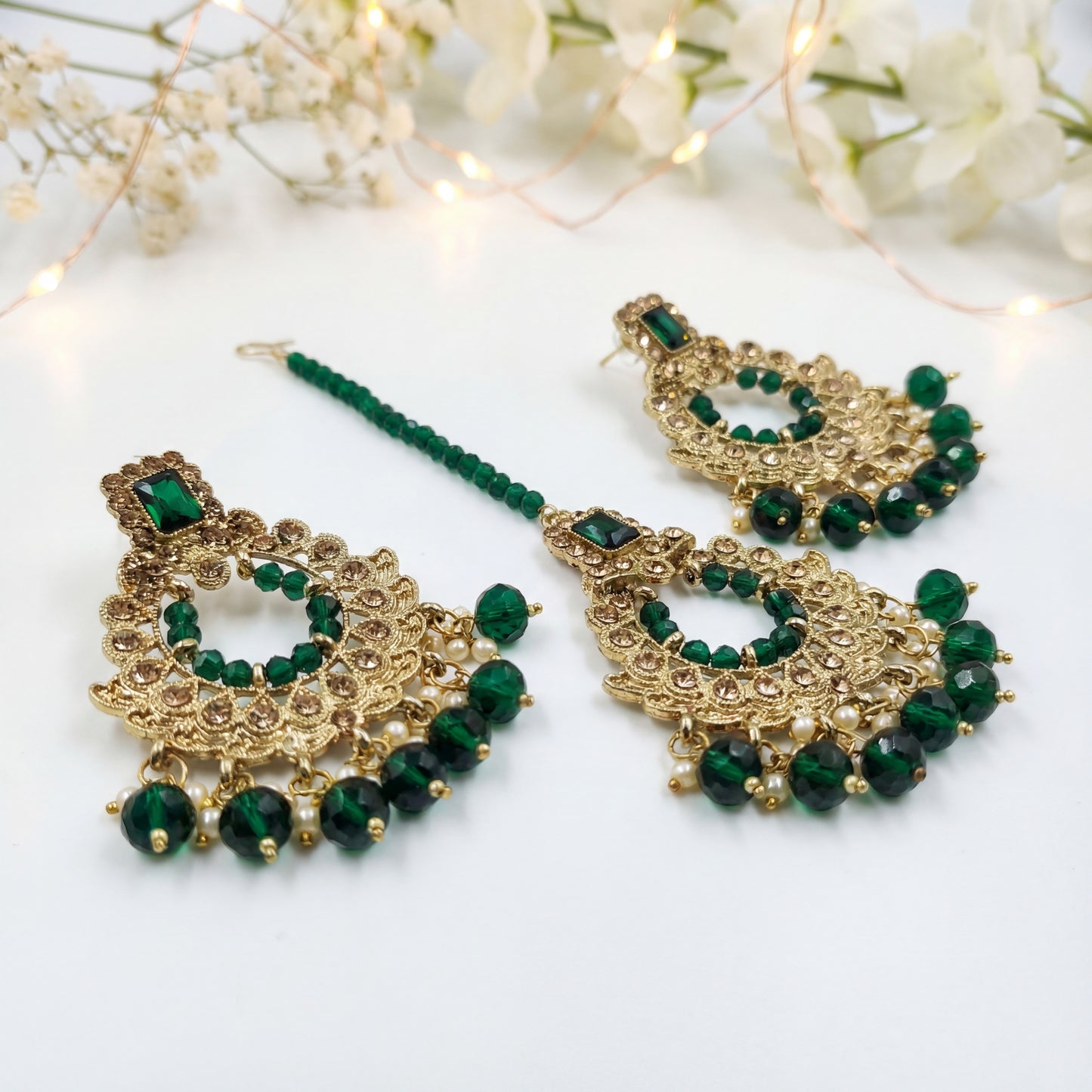 green earrings and mang tikka set