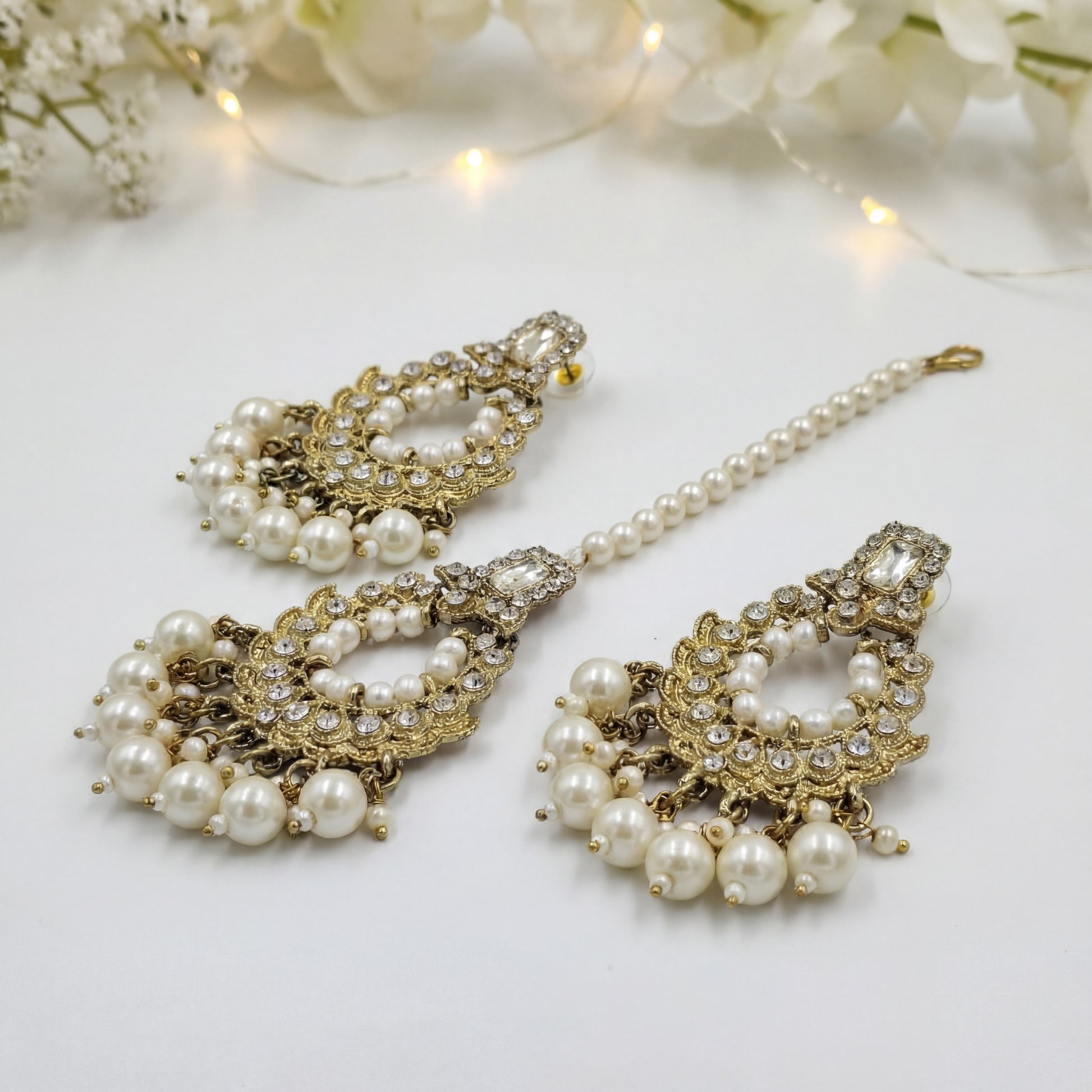 Golden and white pearls earrings maang tikka set