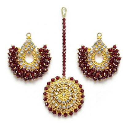maroon chand bali earrings and maang tikka on a white background - trending pakistani jewellery