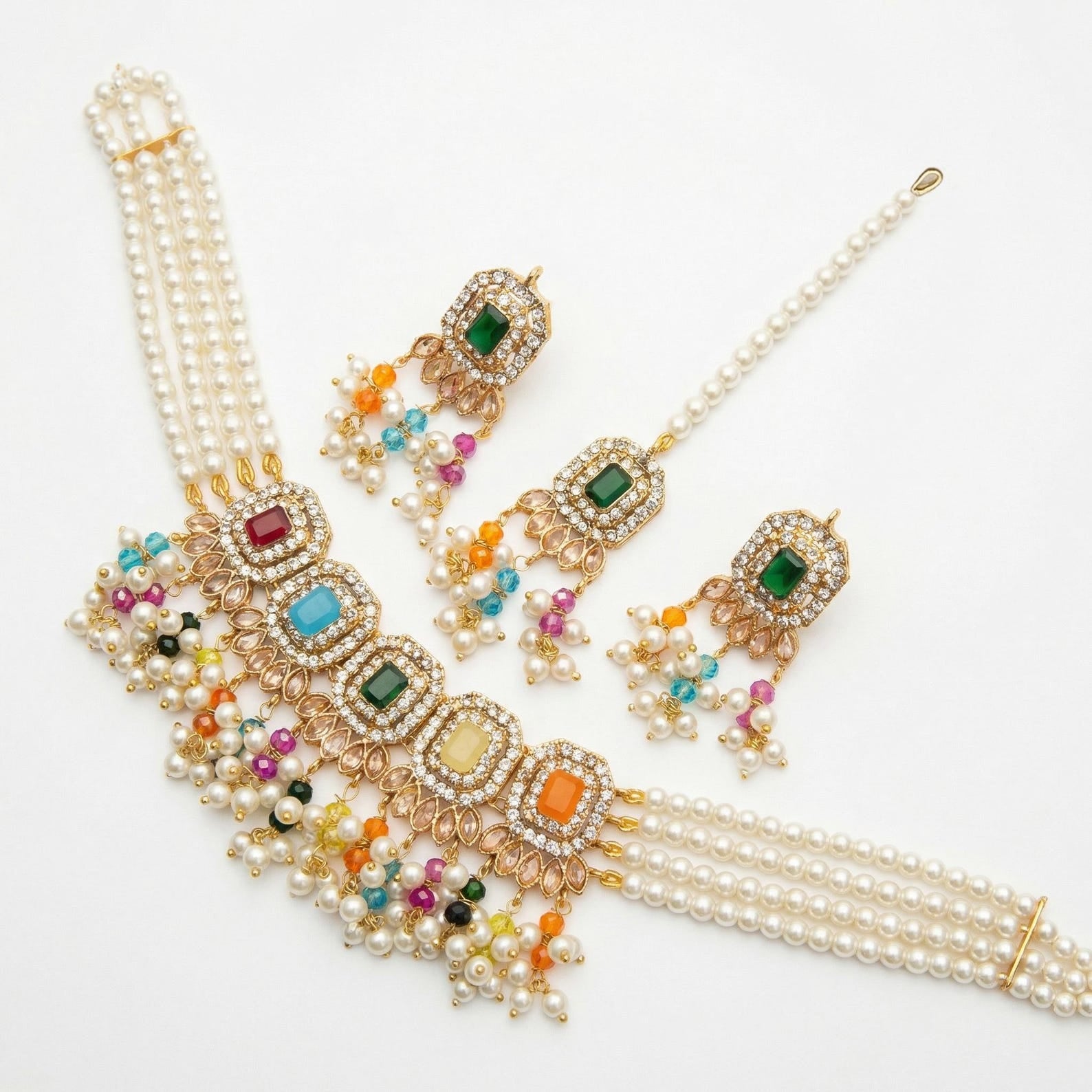 A top-down shot of the layered choker necklace, letting each strand and gold detail be seen clearly