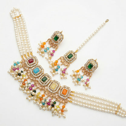 A top-down shot of the layered choker necklace, letting each strand and gold detail be seen clearly