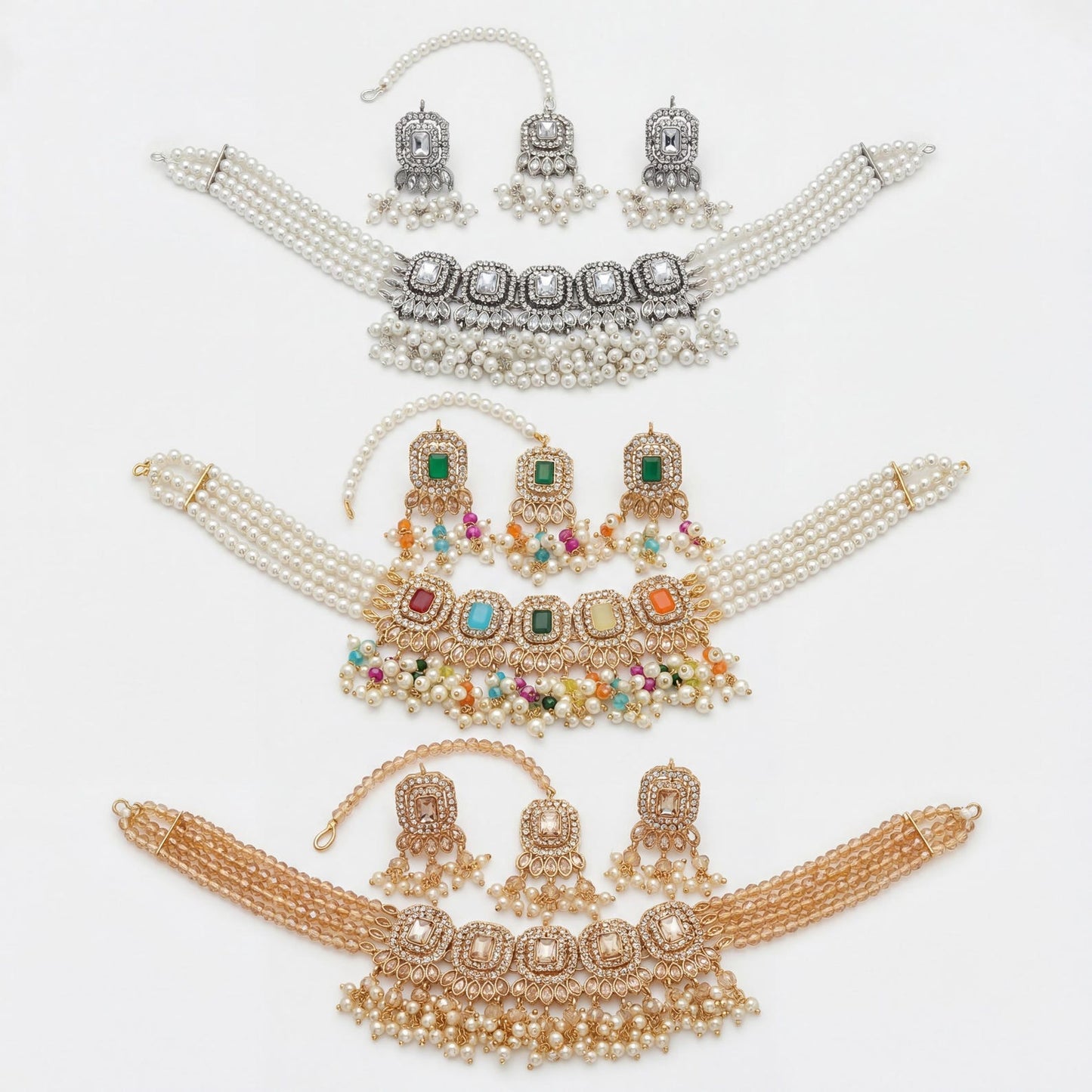 both earrings from the set placed side by side to show their matching stone and metal detail