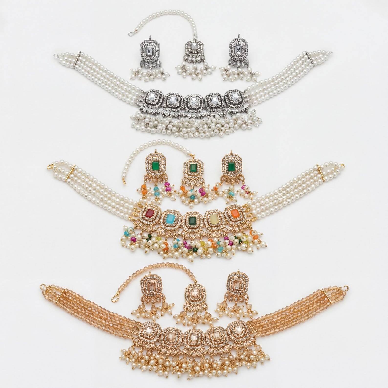 Both earrings from the set placed side by side to show their matching stone and metal detail
