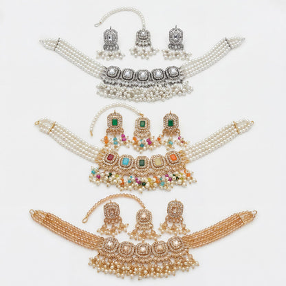 Both earrings from the set placed side by side to show their matching stone and metal detail