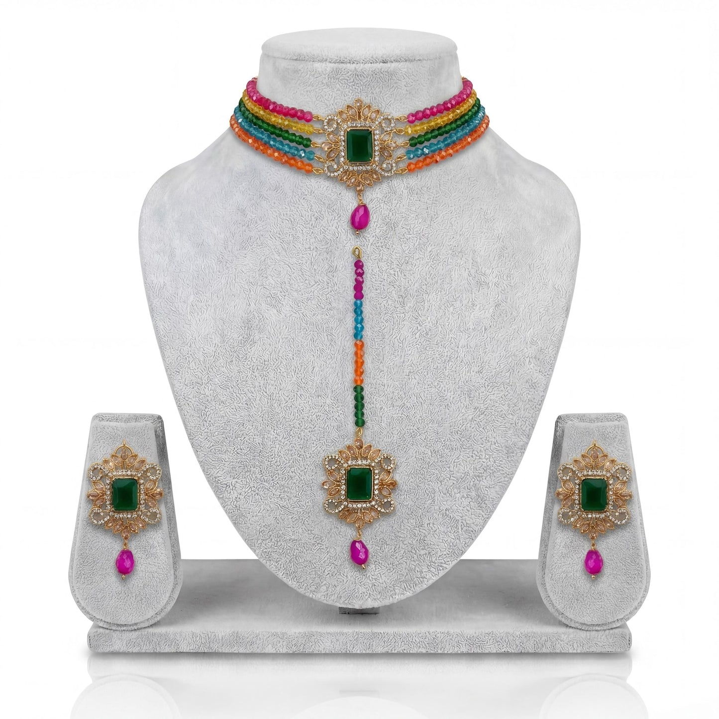 the full multi choker set with earrings and maang tikka arranged neatly together for a clear view