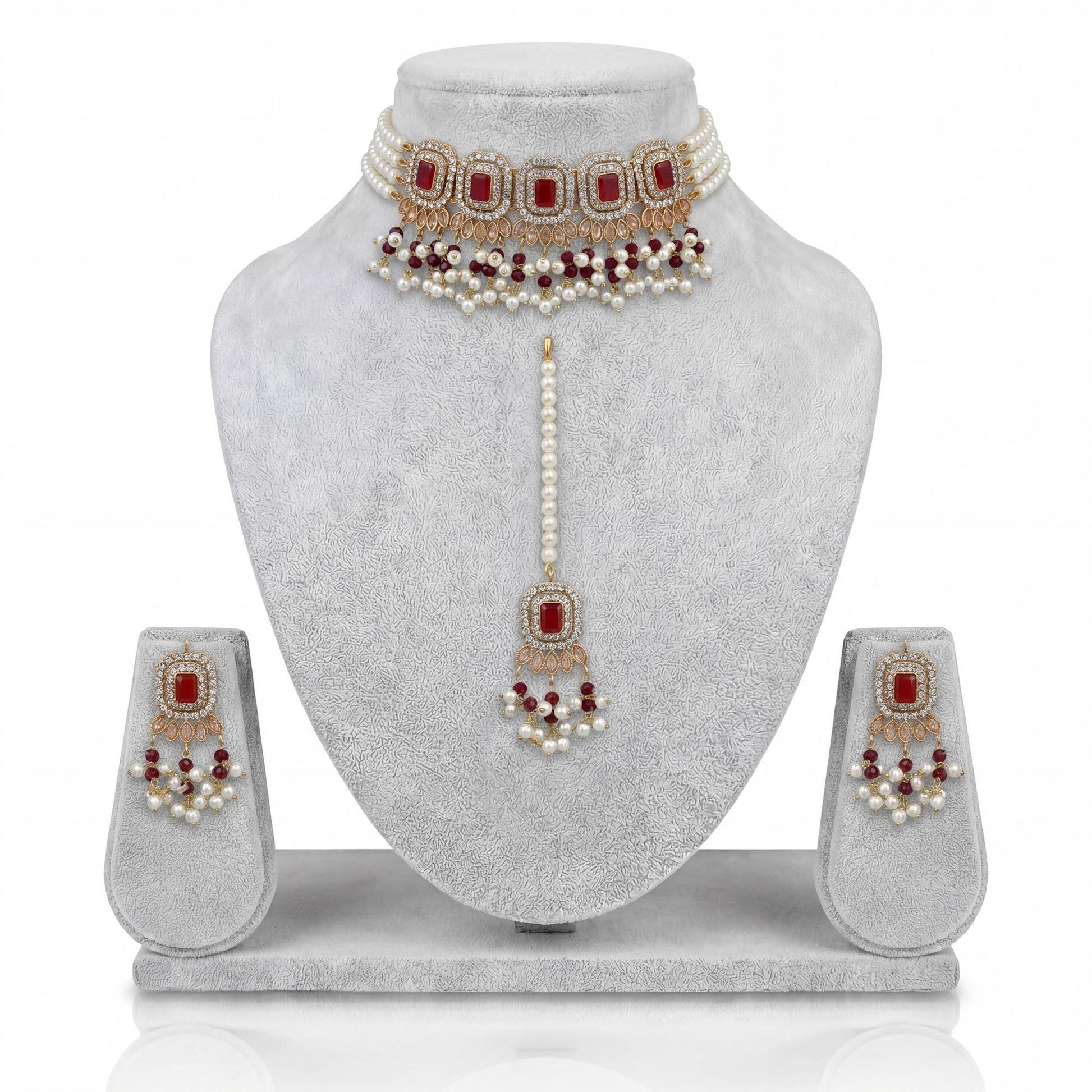Pakistani simple maroon choker set with earrings and maang tikka display indian jewellery
