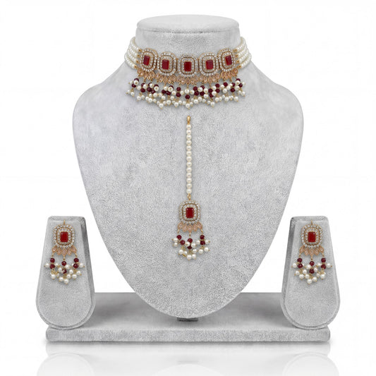Pakistani simple maroon choker set with earrings and maang tikka display indian jewellery
