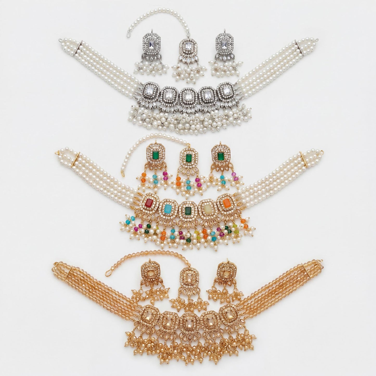 set of pearl and gemstone choker necklaces on a white background pakistani jewellery. 