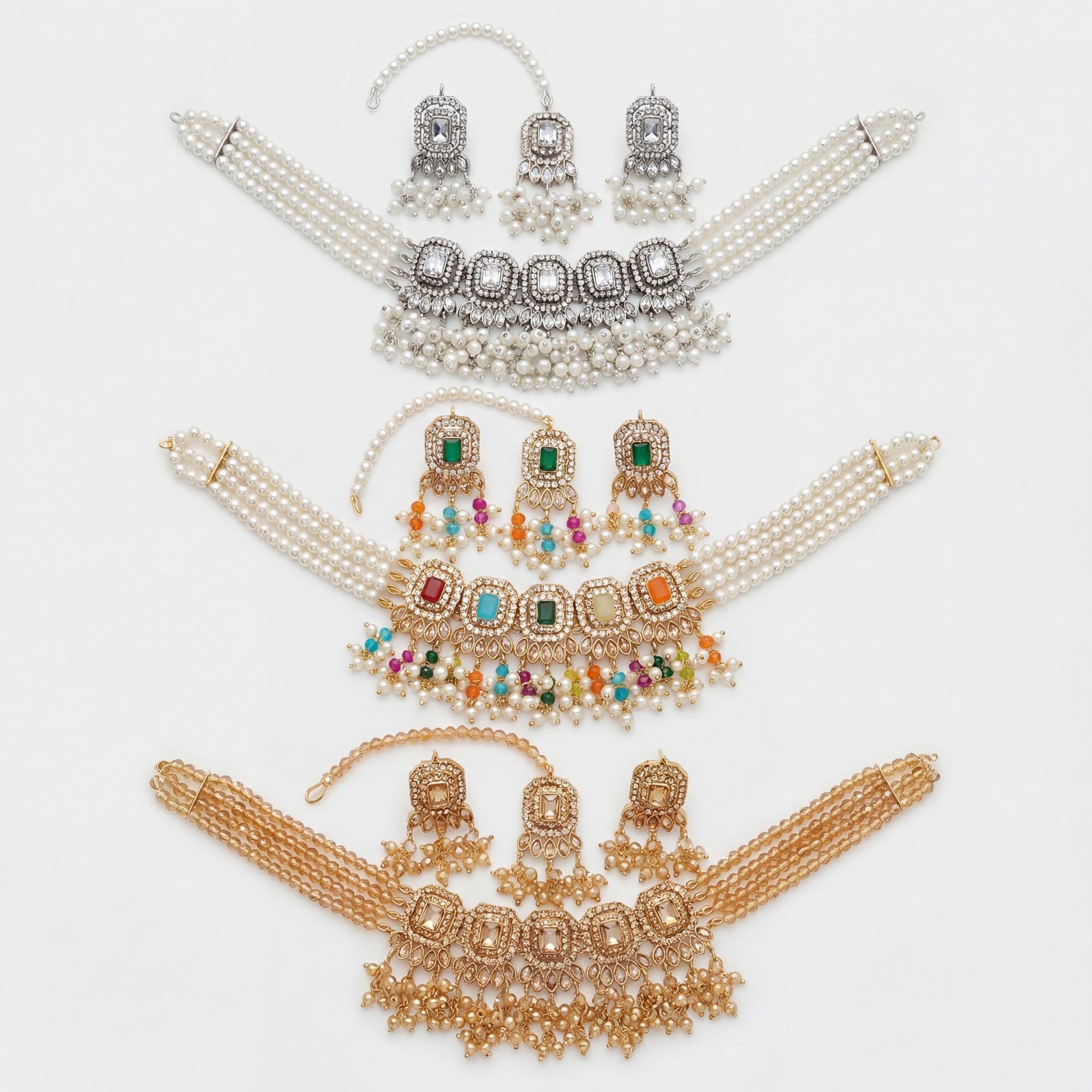 Set of pearl and gemstone choker necklaces on a white background Pakistani jewellery. 