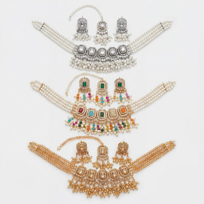 Set of pearl and gemstone choker necklaces on a white background Pakistani jewellery. 