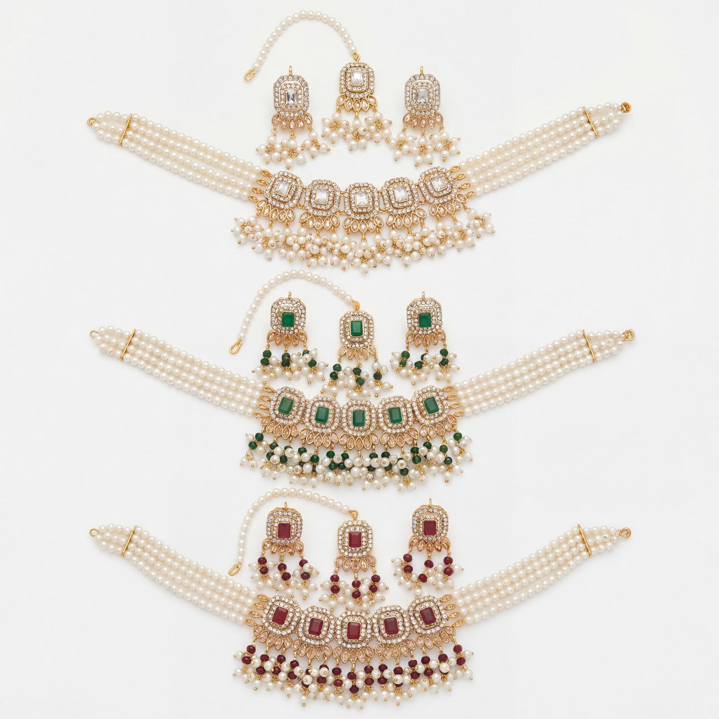 set of gold and pearl jewelry with green and maroon stones on a white background simple pakistani choker necklace