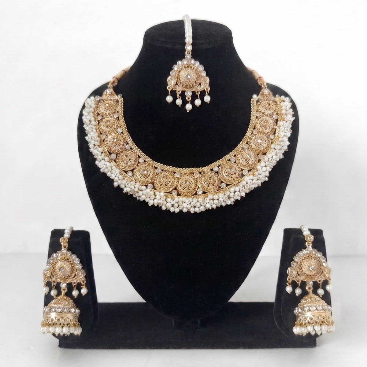 Off-white pearls necklace set exemplifies traditional Pakistani jewelry