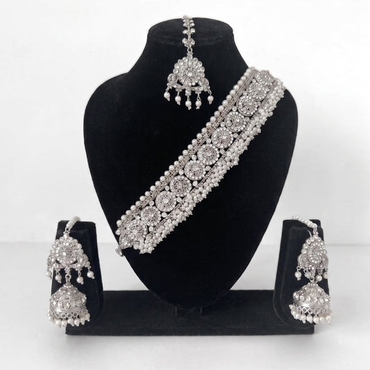 Explore the Silver Choker Set – a luxurious Indian choker necklace with earrings and tikka, perfect bridal jewelry for weddings and events.