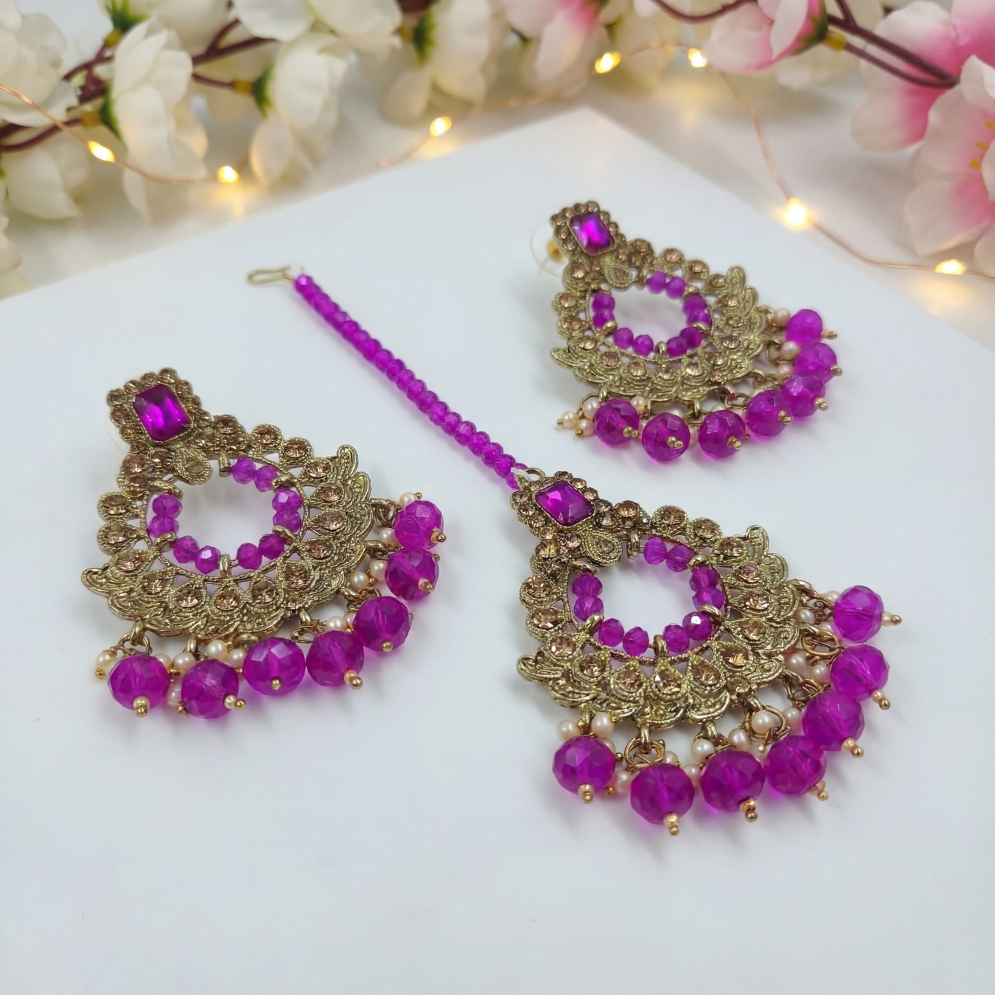 golden and purple pearls earrings maang tikka set