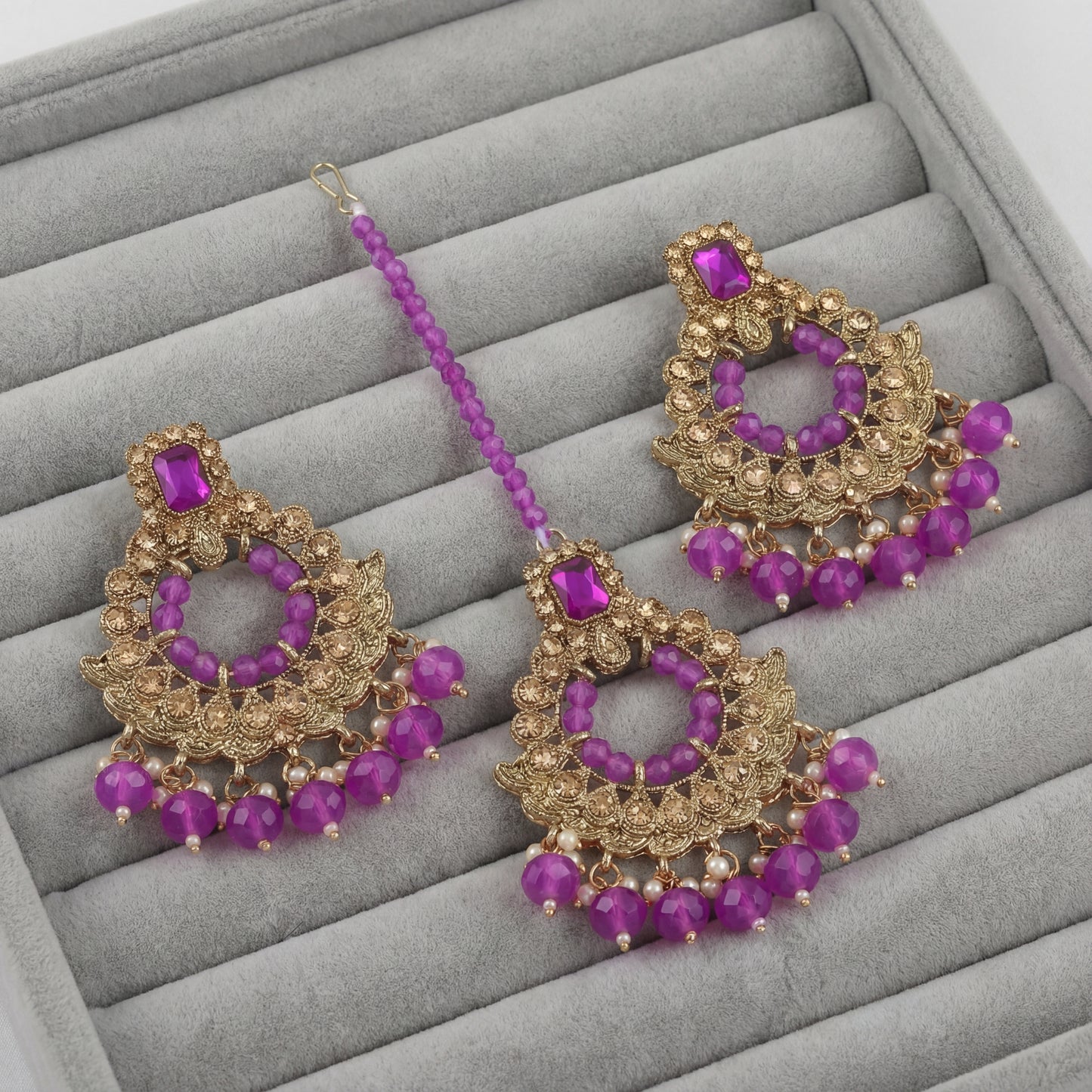 golden and purple pearls earrings maang tikka set
