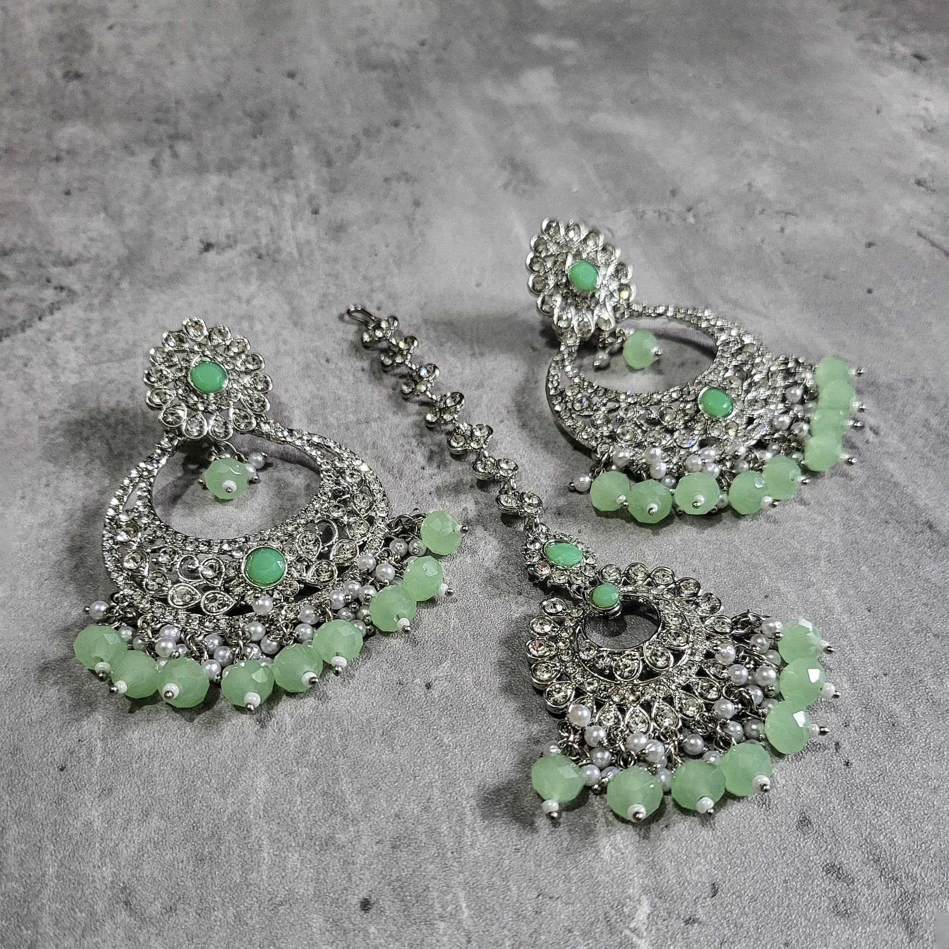 Silver Mint Green Earrings Tikka Set styled elegantly on a mannequin for a trending festive look