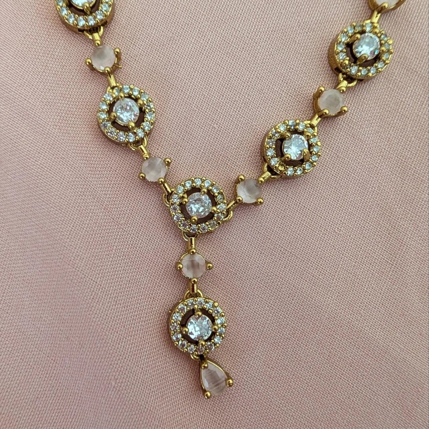this baby pink necklace set on full display, beautifully styled for a bridal or festive party outfit