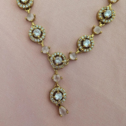 This baby pink necklace set on full display, beautifully styled for a bridal or festive party outfit