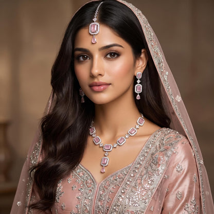 Model wearing the Simple Baby Pink Necklace, Earrings and Tikka Set for a complete festive look