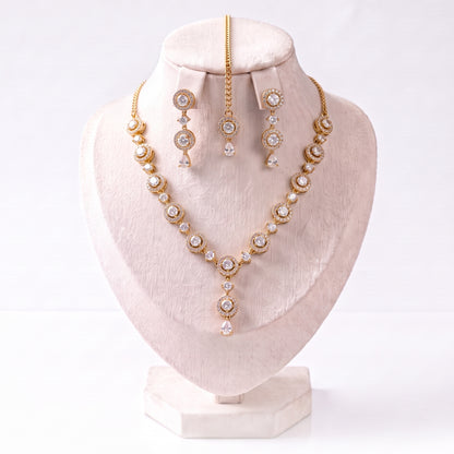 Every piece of the Simple Gold and White Necklace, Earrings and Tikka Set laid out neatly together