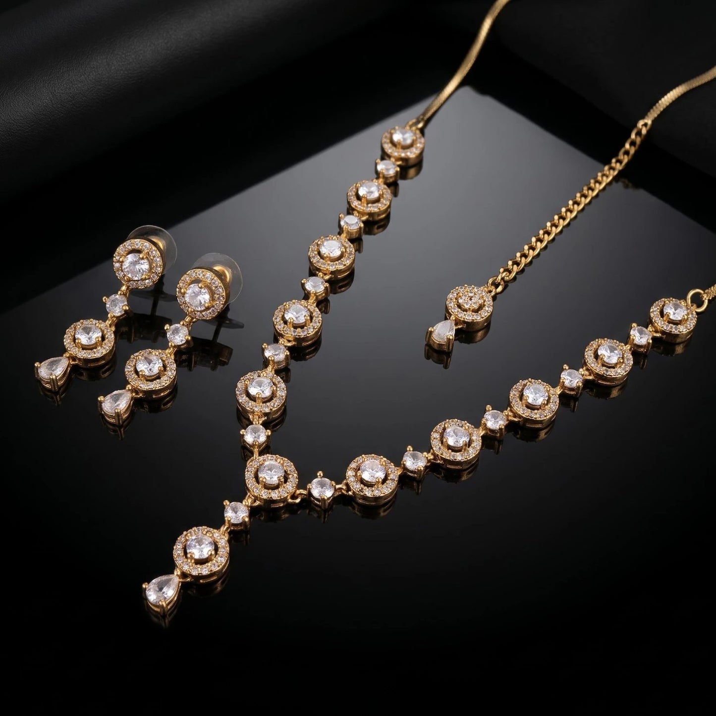 a macro shot of the gold and white necklace, capturing its fine texture and shine up close