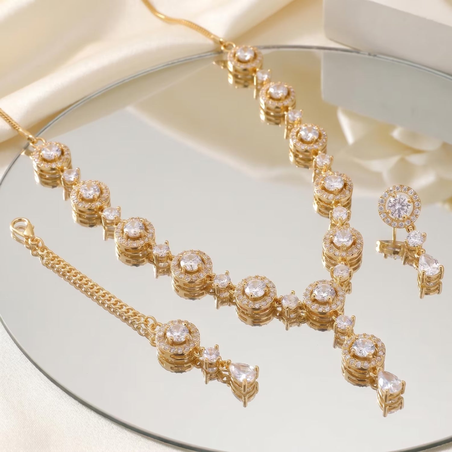 This gold and white necklace set worn by a mannequin, styled for a wedding or festive occasion