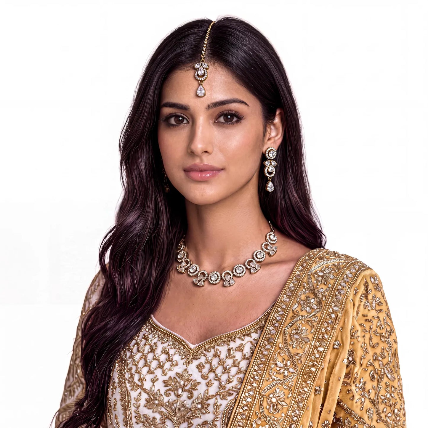model wearing the simple gold and white necklace, earrings and tikka set for a complete festive look