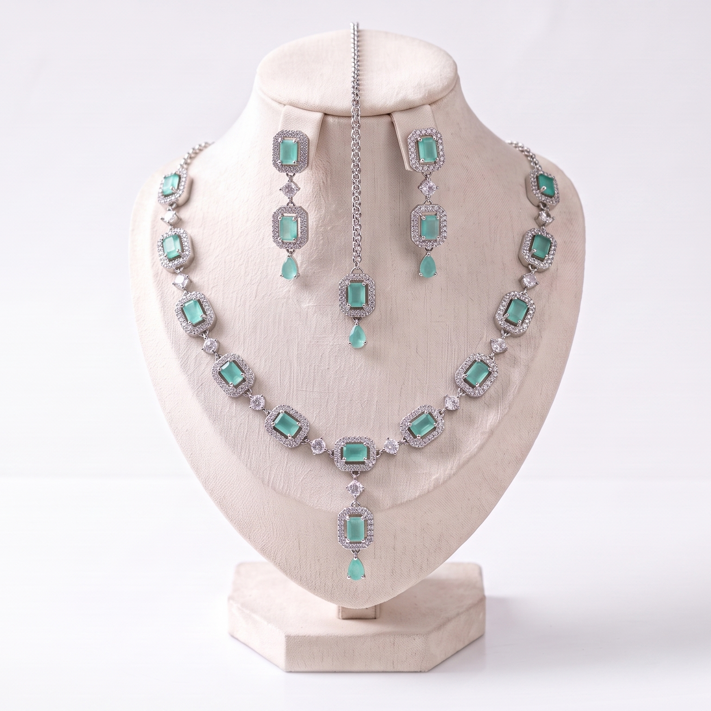 simple mint green necklace set with earrings and tikka displayed together showing soft detailing