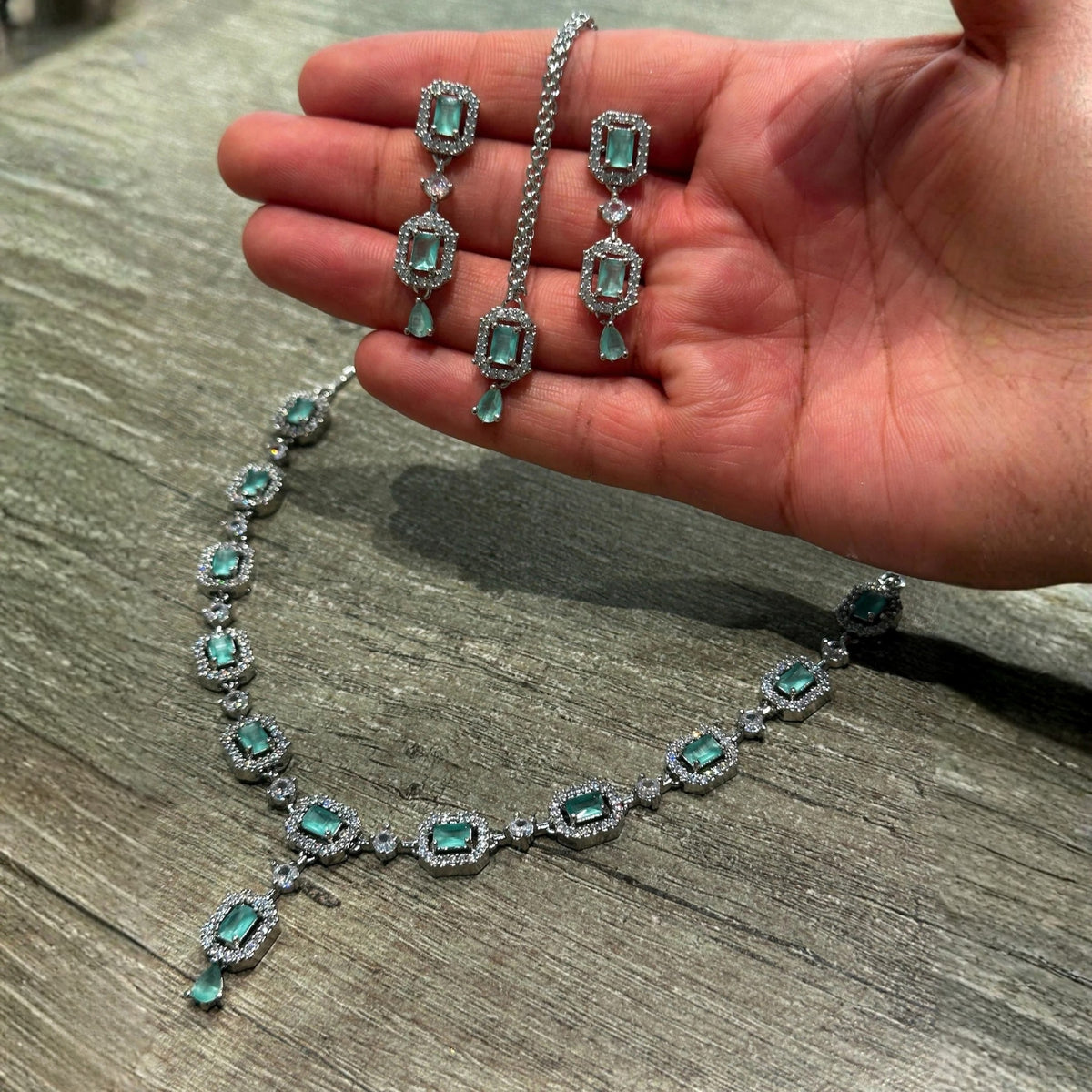 mint green necklace set styled elegantly on a mannequin for a wedding and party jewellery look