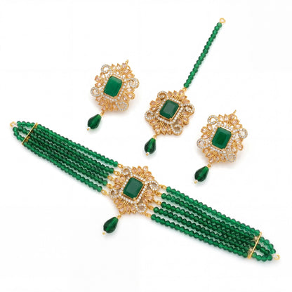 Green beaded necklace with gold accents and matching earrings on a white background pakistani jewellery