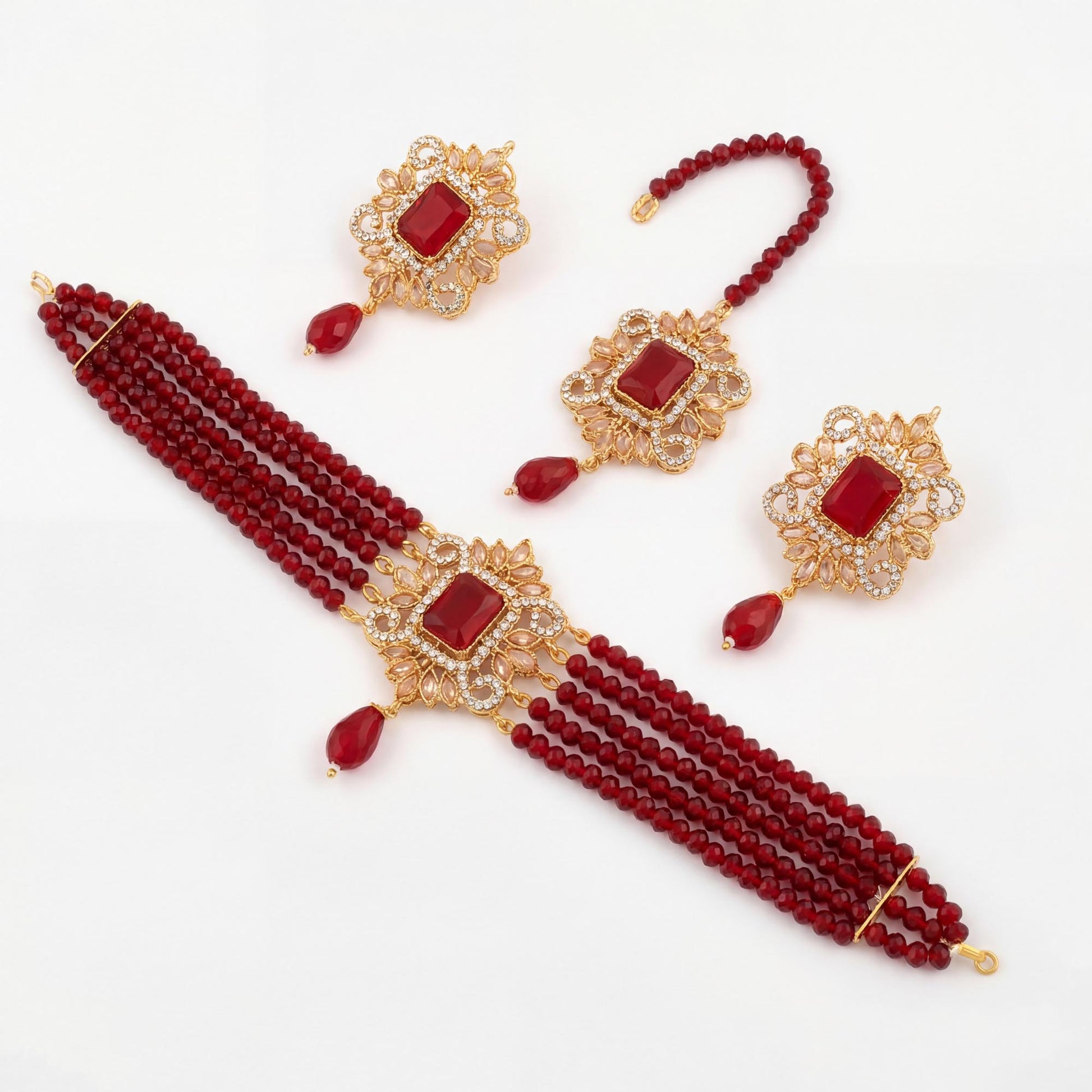 Maroon beaded necklace with gold accents and matching earrings on a white background simple pakistani jewelry