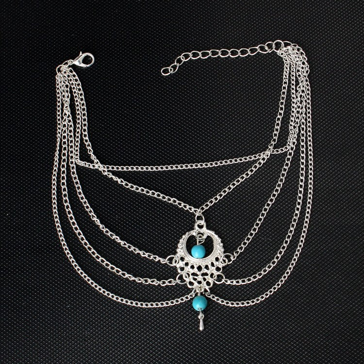 Trendy Bohemian anklets with silver chains and turquoise accents, perfect for adding style to casual and beachwear looks