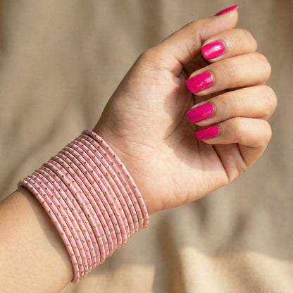Model wearing baby pink bangles on wrist showing elegant slim stack in Pakistani bridal jewellery style indian jewellery