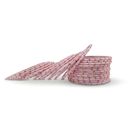 Close-up of model wrist wearing baby pink bangles showing soft pastel colour and festive Pakistani jewellery look indian jewellery