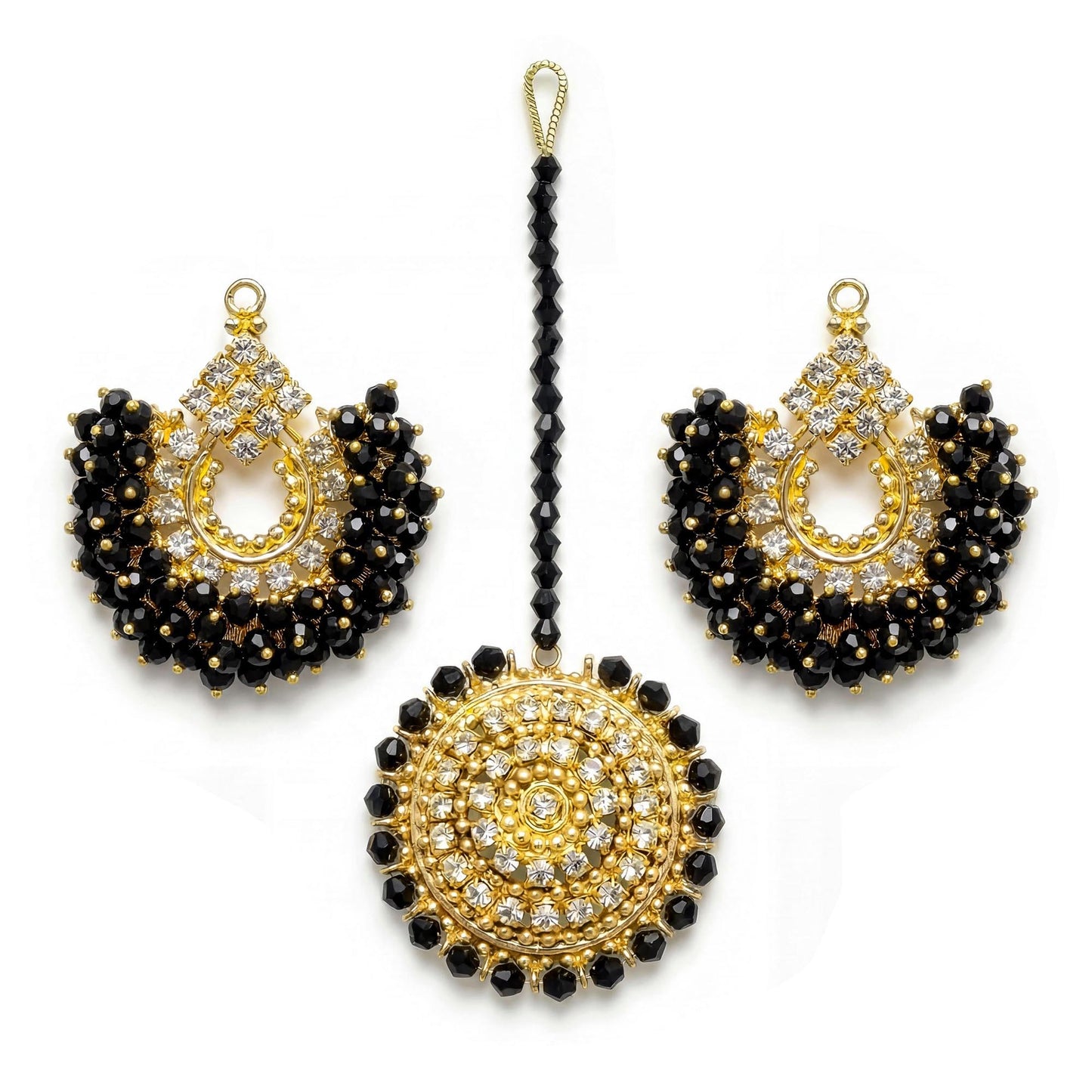 gold and black chand bali earrings and maang tikka on a white background - trending pakistani jewellery