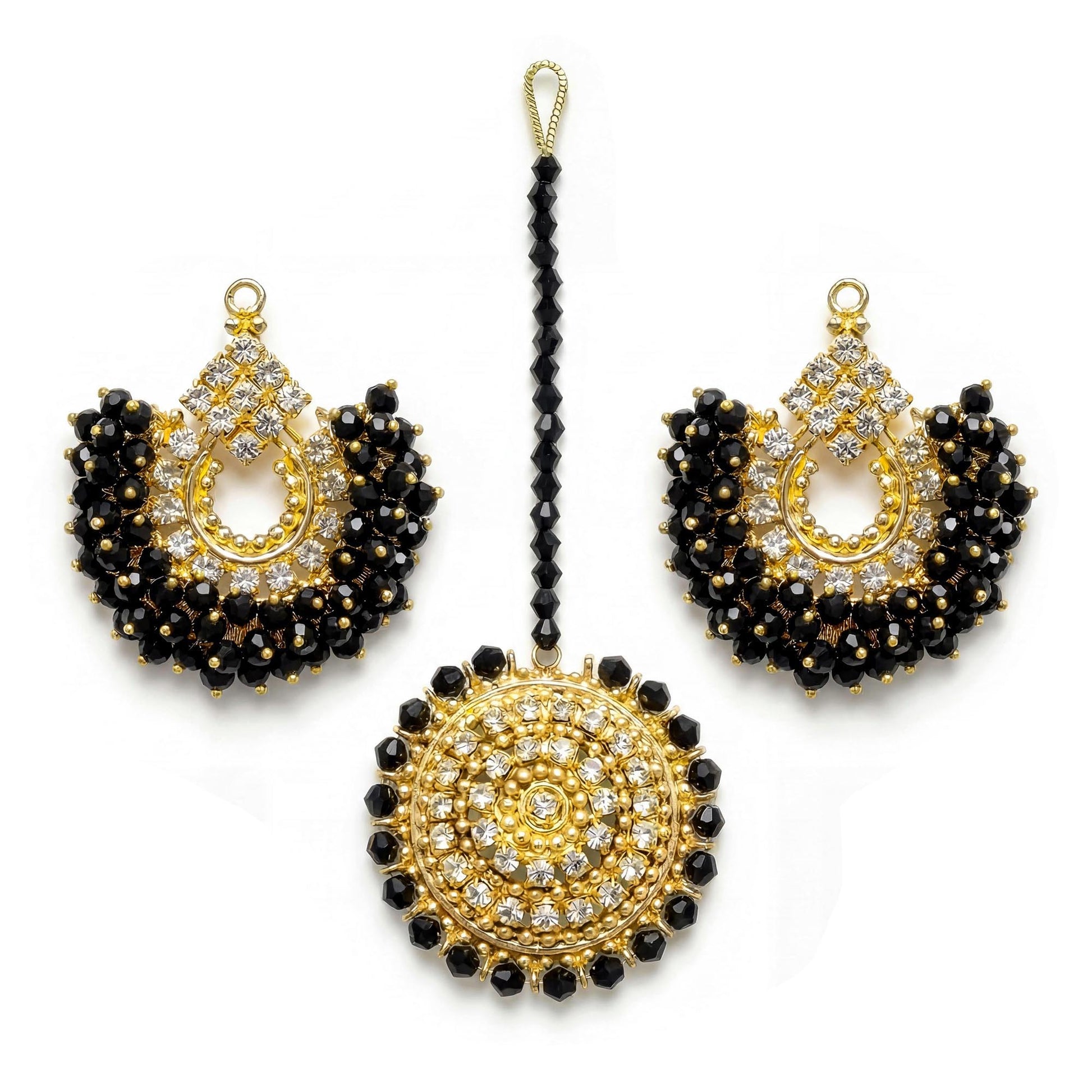 gold and black chand bali earrings and maang tikka on a white background - trending pakistani jewellery