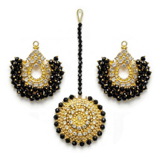 gold and black chand bali earrings and maang tikka on a white background - trending pakistani jewellery