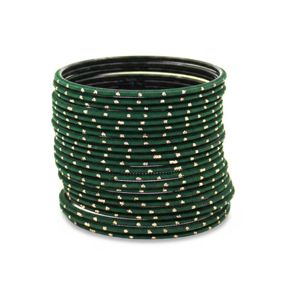Close-up of dark green bangles with golden dots stack highlighting polished finish and bridal Indian jewellery craftsmanship indian jewellery