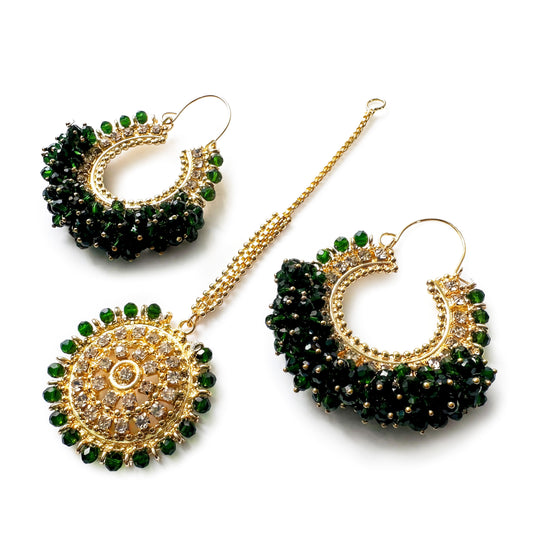 Dark green chand bali earrings and maang tikka set on a white background - Trending pakistani jewellery. 