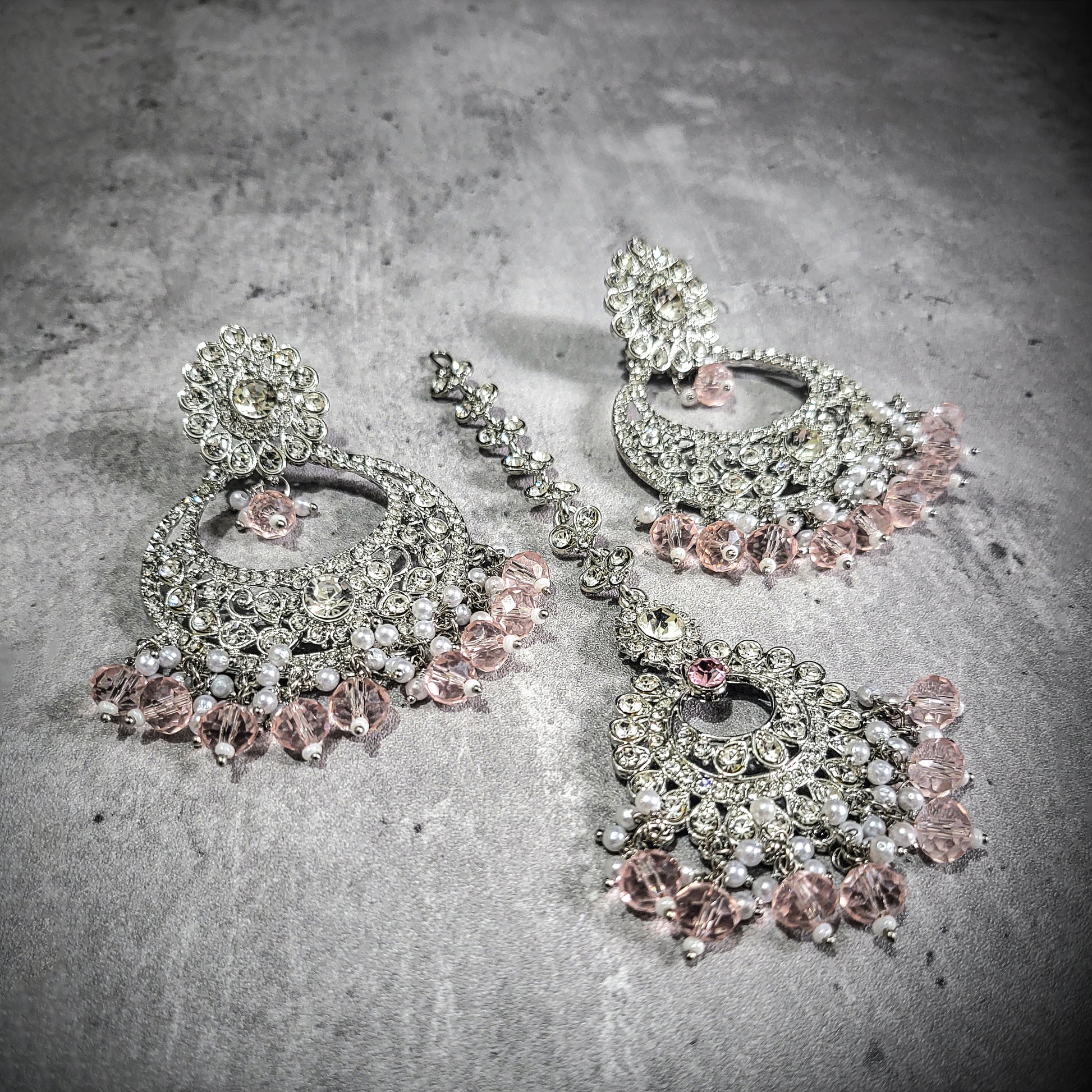 Shop the latest trend: silver and baby pink earrings tikka set