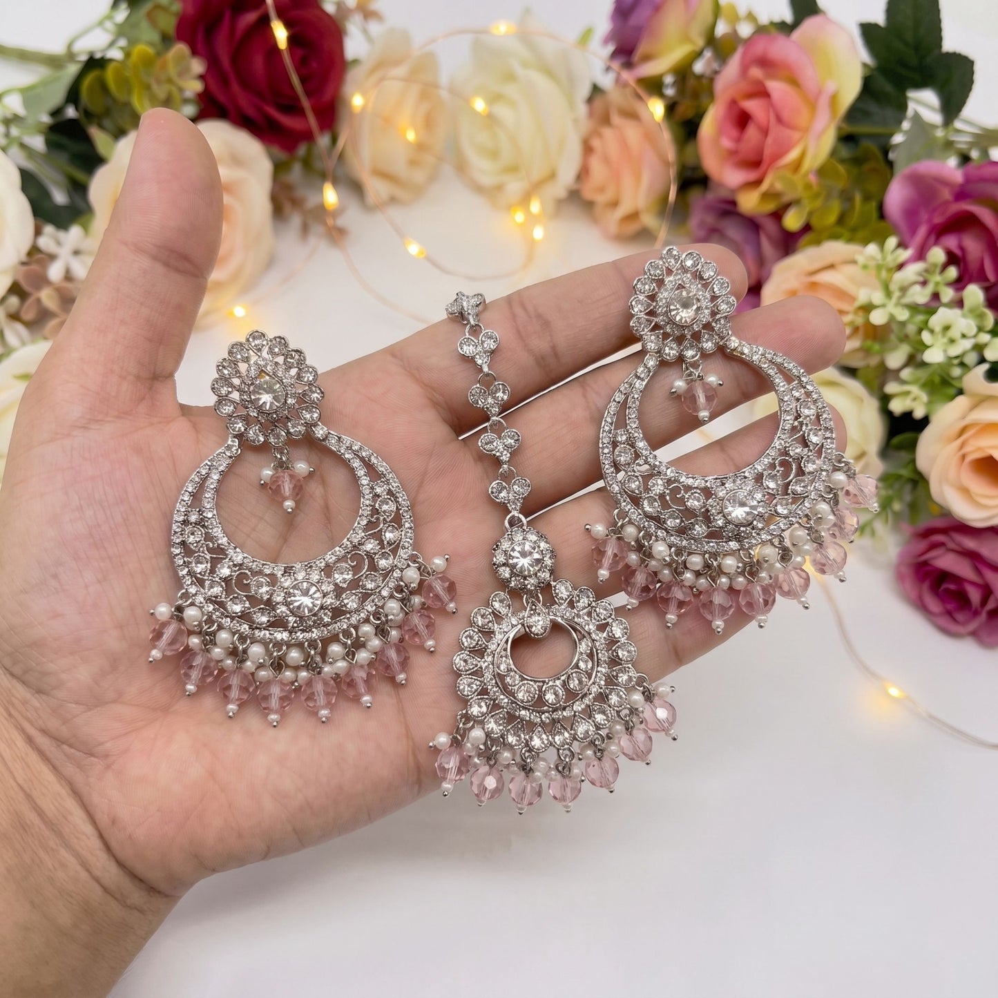 silver and baby pink earrings tikka set