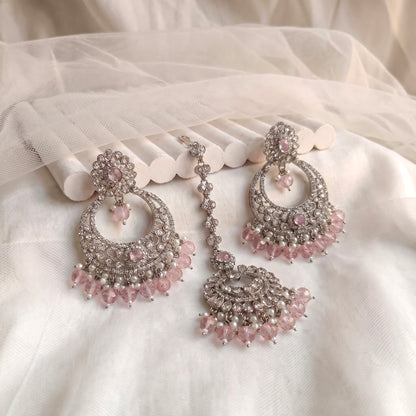 silver and baby pink earrings tikka set