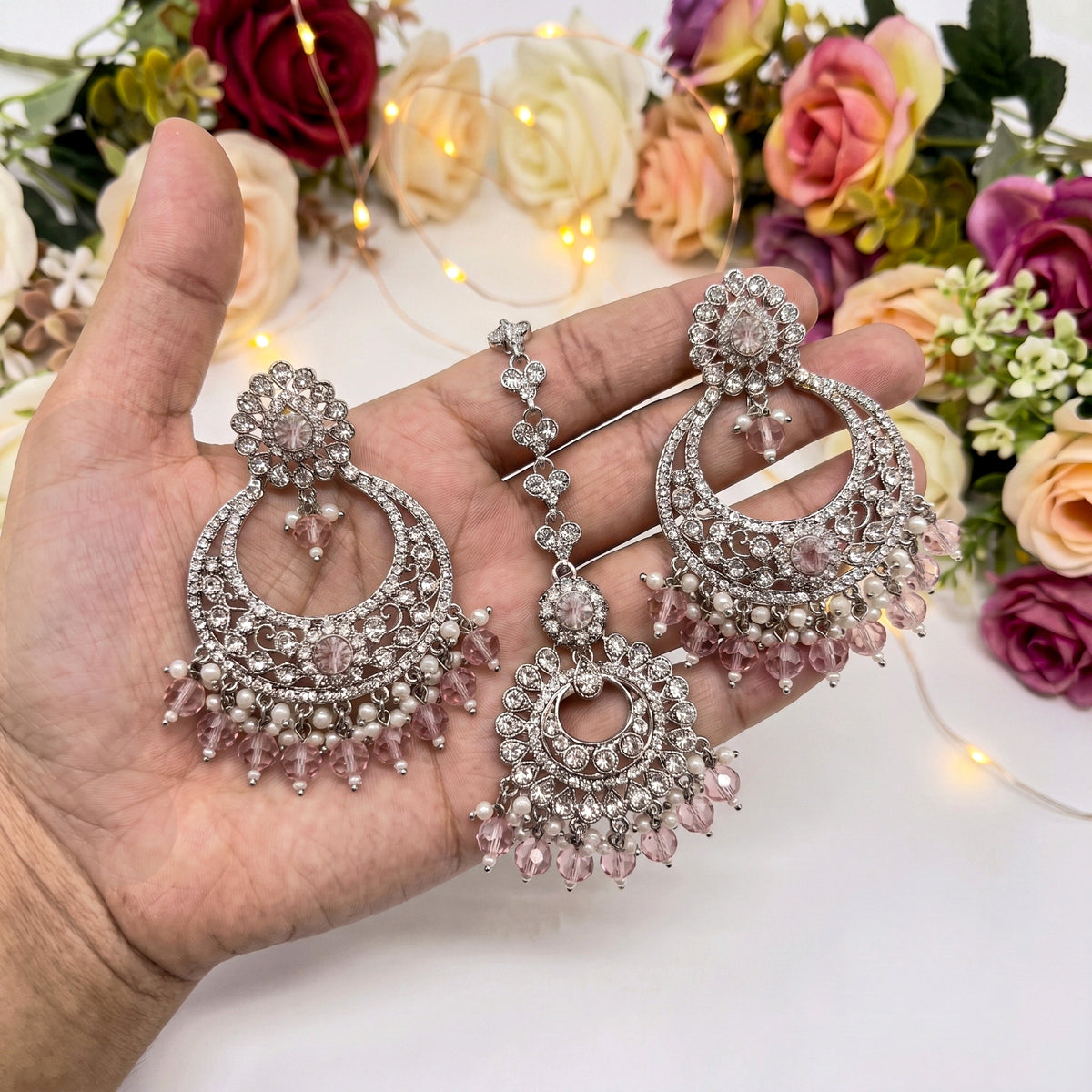 silver and baby pink earrings tikka set